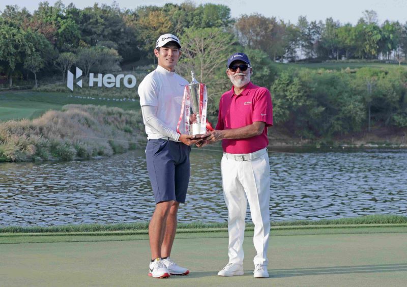 Nakajima trophyJapan’s Keita Nakajima receives the Hero Indian Open trophy from Hero MotoCorp executive chairman Dr Pawan Munjal at the DLF Golf and Country Club on Sunday. Image courtesy Getty Images.